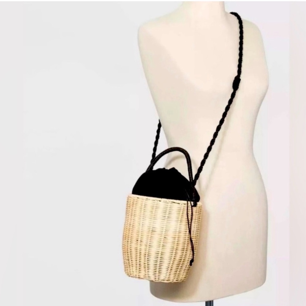 A NEW DAY Black and Tan Crossbody bucket Bag with draw string closure.
